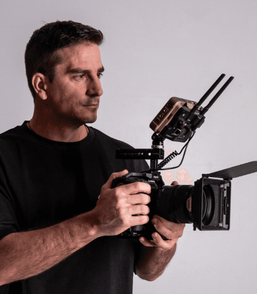 Yuri, co-founder of Untitled Media, holding a cinema camera rig